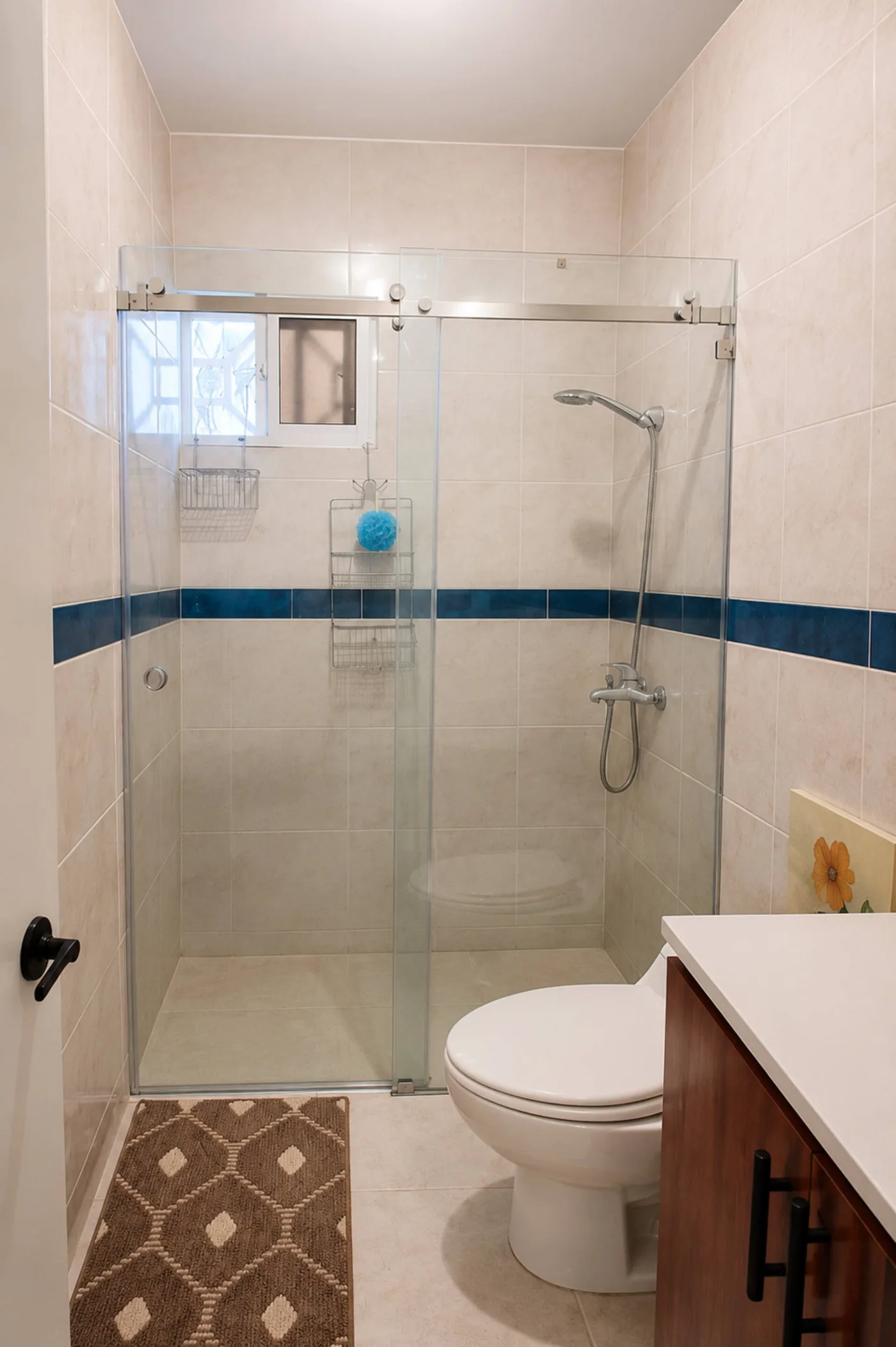 Ducha con mampara de cristal